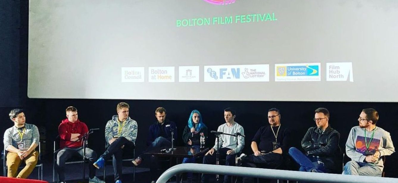 Futureworks students. staff and alumni sat on stage at Bolton Film Festival