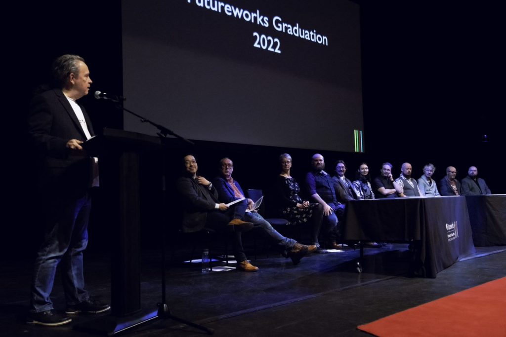 Futureworks tutors sat on stage at Futureworks Graduation Ceremony 2022